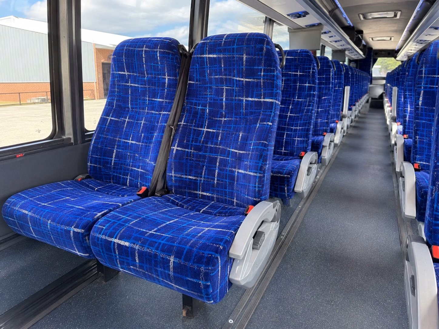 how distance and duration affect charter bus rates in lansing